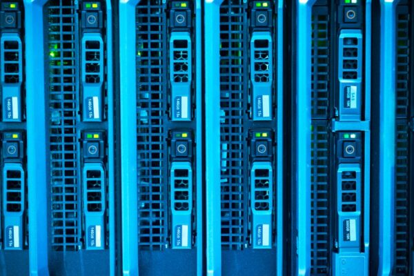 Detailed image of illuminated server racks showcasing modern technology infrastructure.