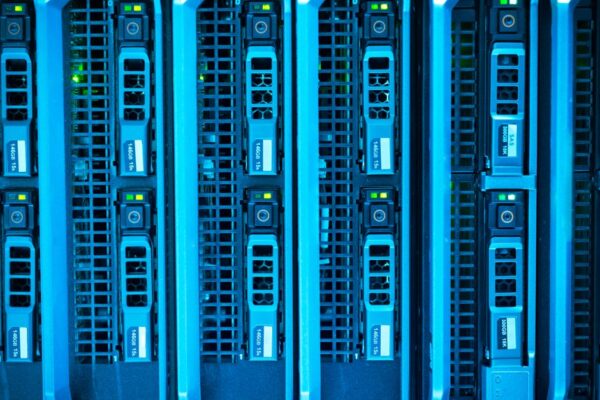 Detailed image of illuminated server racks showcasing modern technology infrastructure.