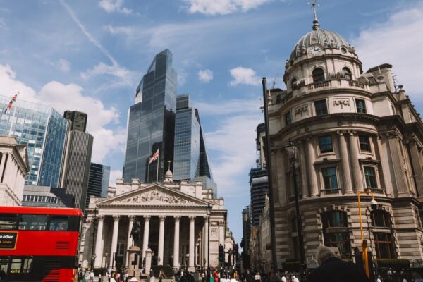 Vibrant street view of London's skyline featuring modern skyscrapers and historic architecture.