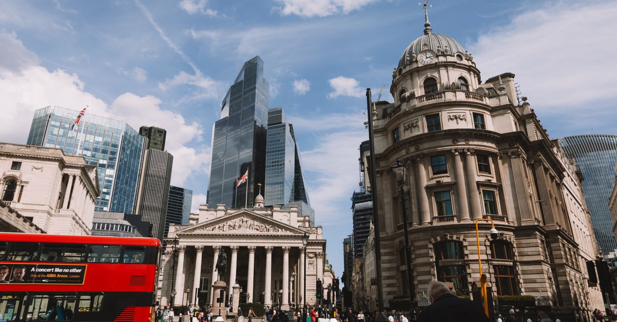 Vibrant street view of London's skyline featuring modern skyscrapers and historic architecture.
