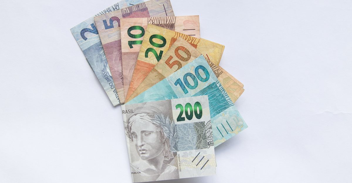 A fan arrangement of colorful Brazilian Real banknotes on a white background showcasing different values.