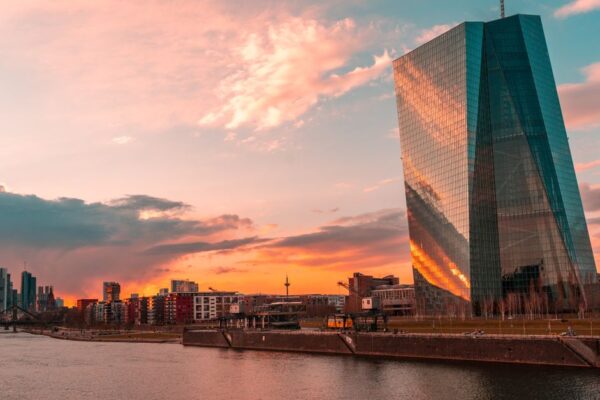 Stunning sunset over Frankfurt's skyline featuring the iconic ECB Tower and Main River.