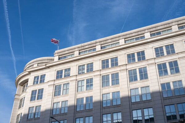 Elegant office building under a clear blue sky in Washington, D.C.